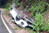 Three escape unhurt as car overturns near Charmadi ghat